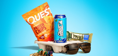A bag of Quest protein chips, Ghost Energy drink, and David protein bar