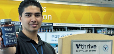 Health Enthusiast holding a bottle of Vthrive Bioactive Men's One Daily Multi