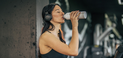 A woman drinking creatine