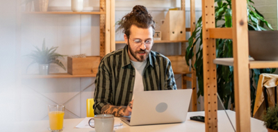 Man sitting using a laptop